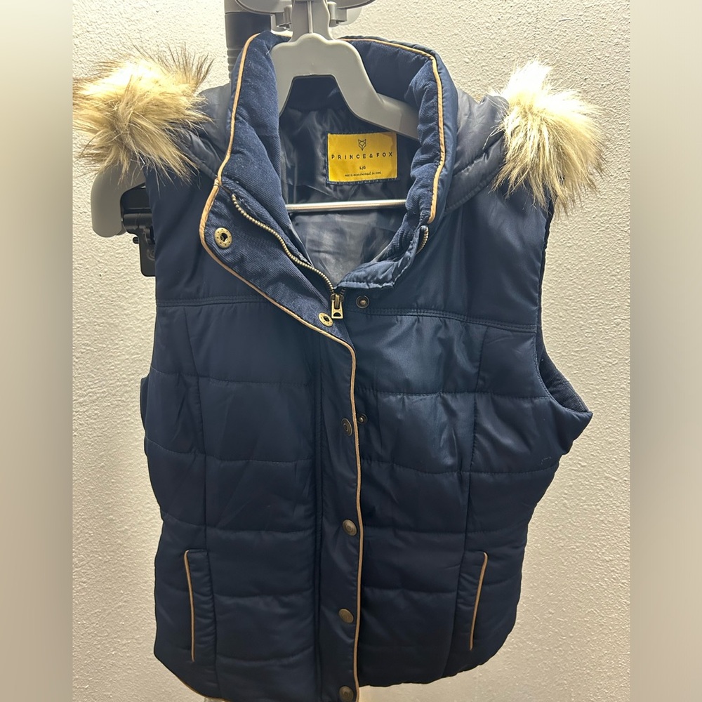 Prince and Fox puffer vest. Faux fur lined hood.